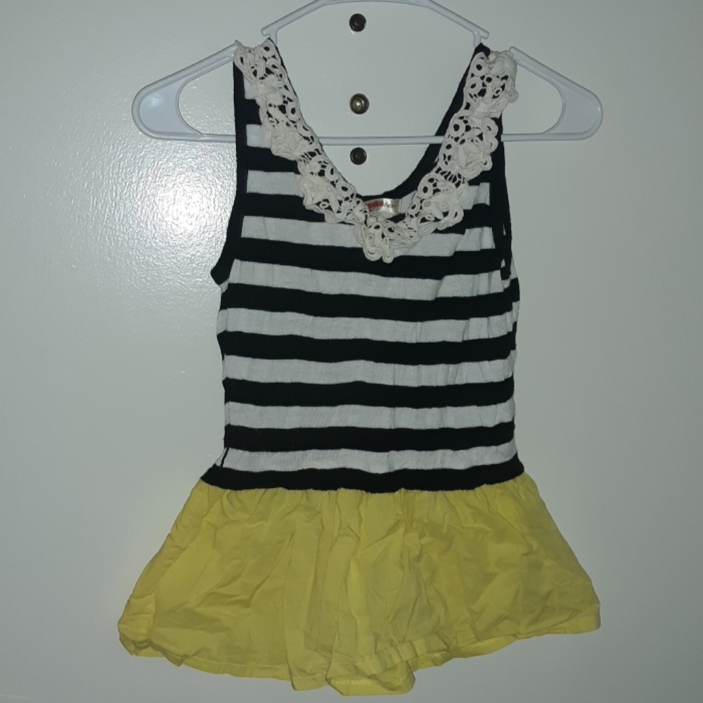 Black and white striped top with yellow ruffle